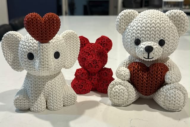 Textured elephant and bear figures with heart details, printed by Gaeta 3D Works